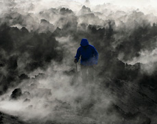 A small earthquake caused the volcanic activity to cease. We explored the steaming heaps of cooling lava rock and ash. I made photographs of the Rohan clothing amidst the smoking ridges of lava.