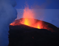 Just days after the initial eruption at Fimmvorduhals, a prominent volcanic cone of ash and lava had formed. Fountains of molten rock are hurled several hundred feet into the sky. 